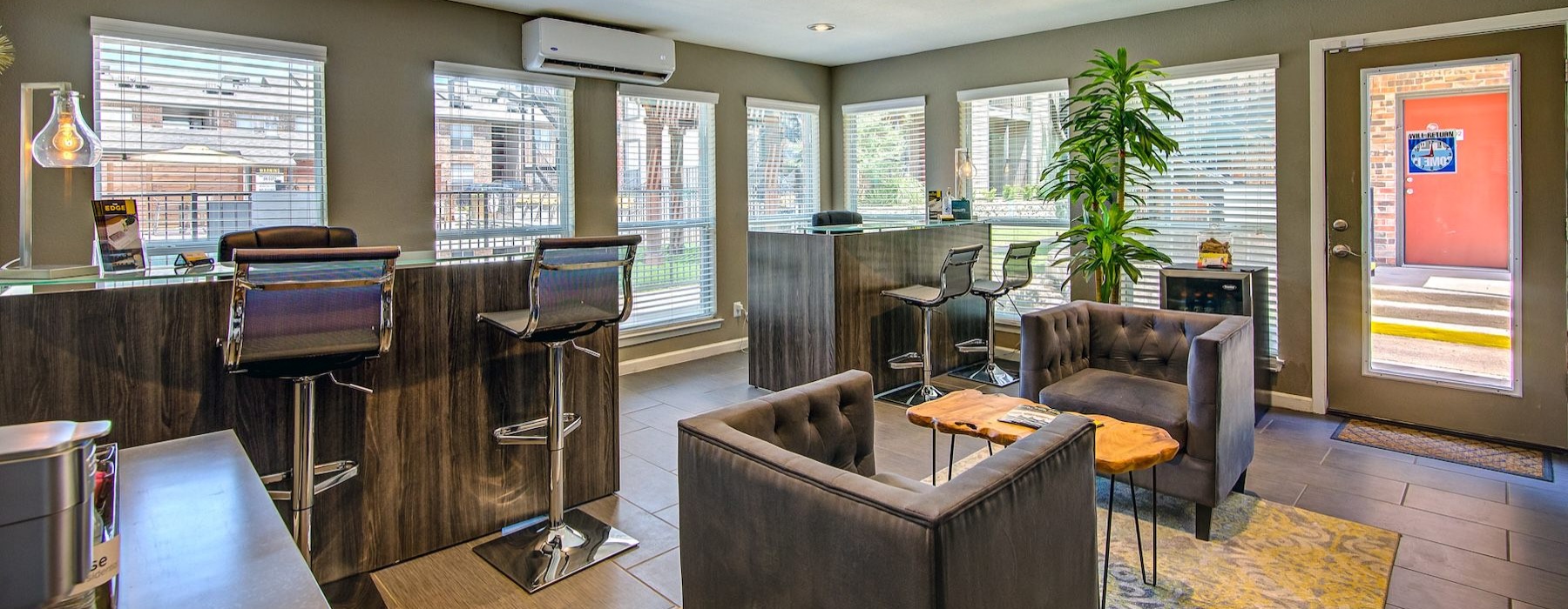 a leasing office with chairs and tables
