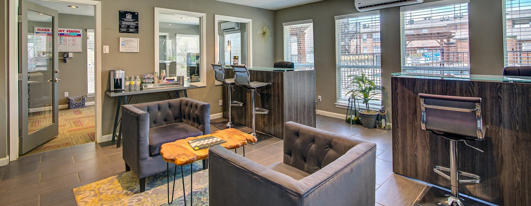 a leasing office with chairs and tables
