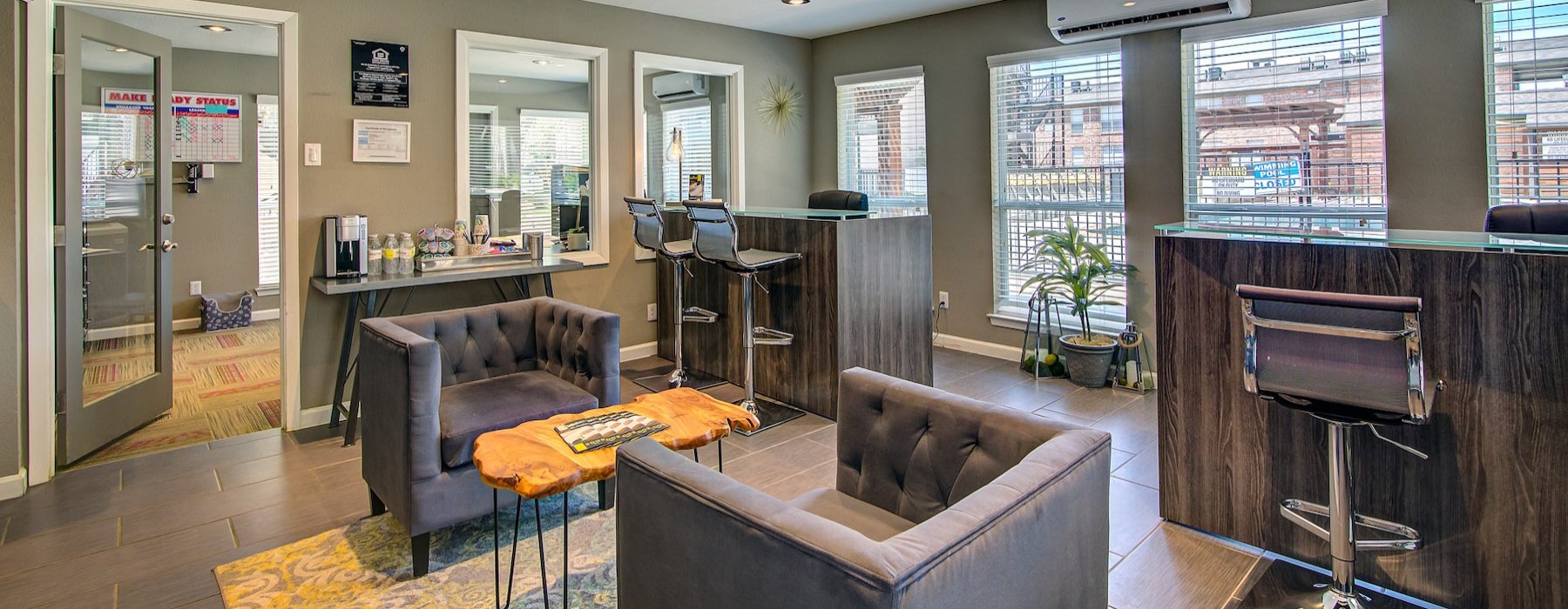 a leasing office with chairs and tables