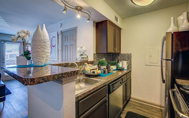 a kitchen with marble counters