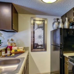 a kitchen with black appliances
