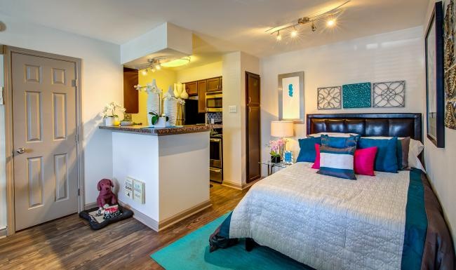 a bedroom with a bed and a counter